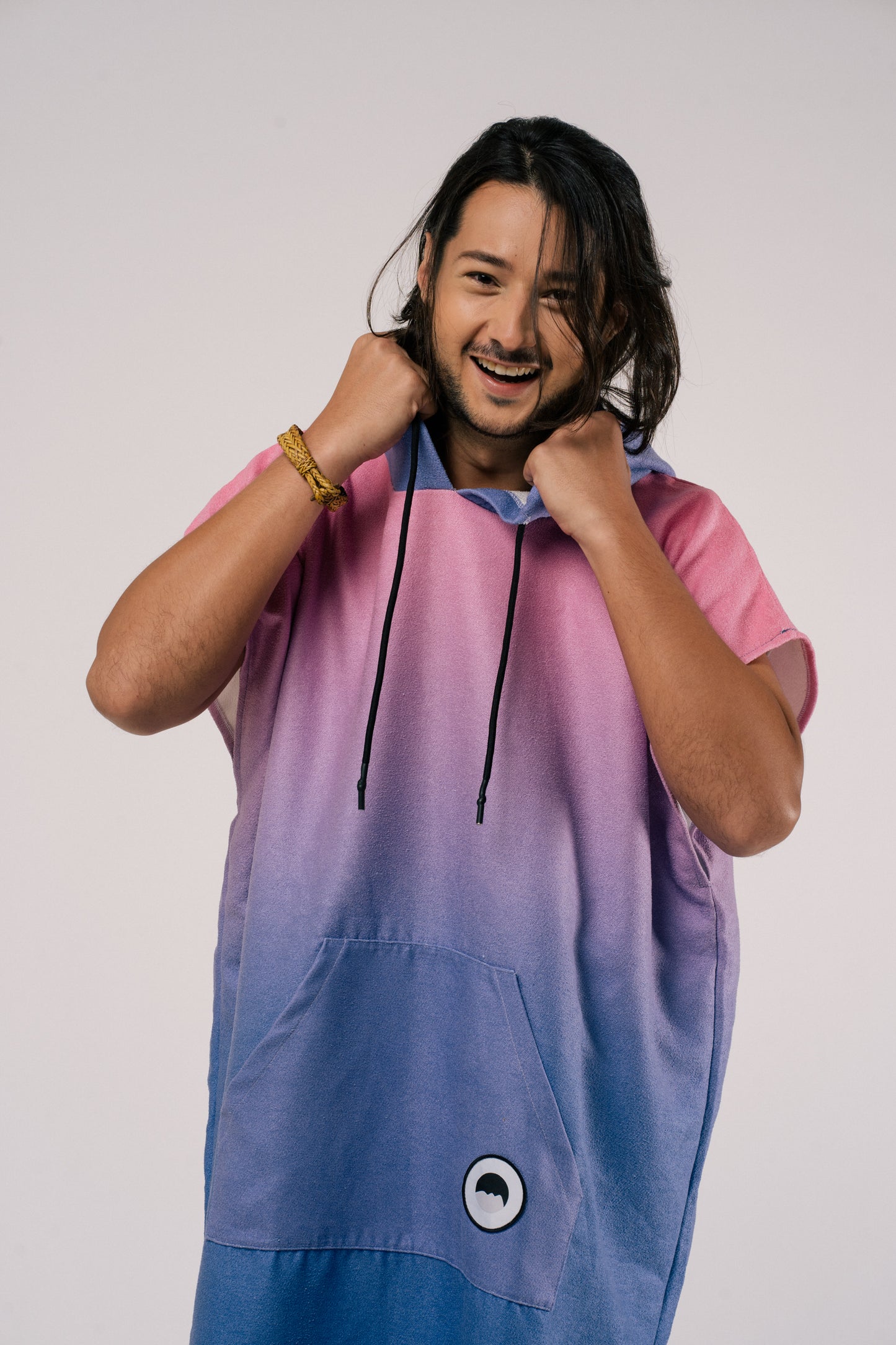 Male model holding hood of changing poncho towel in Aurora, Outwhere Philippines