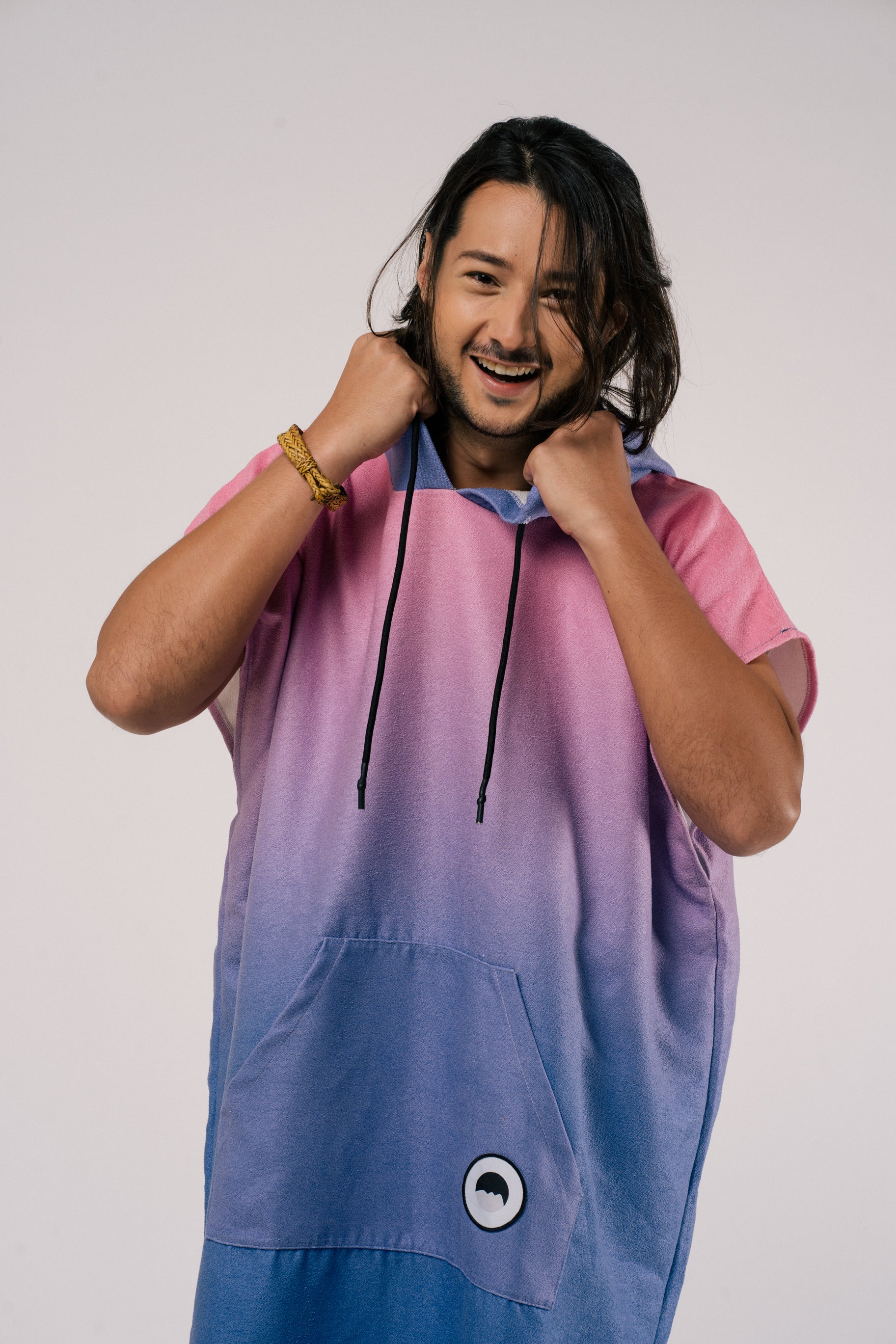 Male model holding hood of changing poncho towel in Aurora, Outwhere Philippines