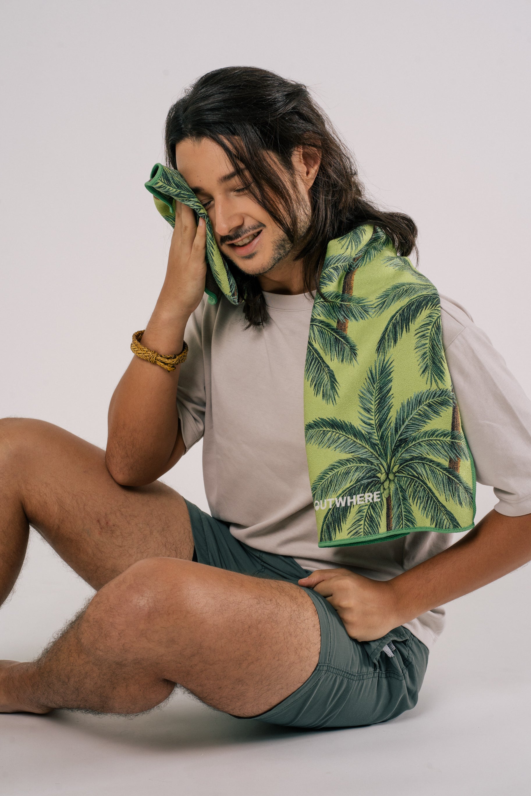 Male model with Outwhere PH Everywhere towel in Buko (coconut) wiping his face with towel