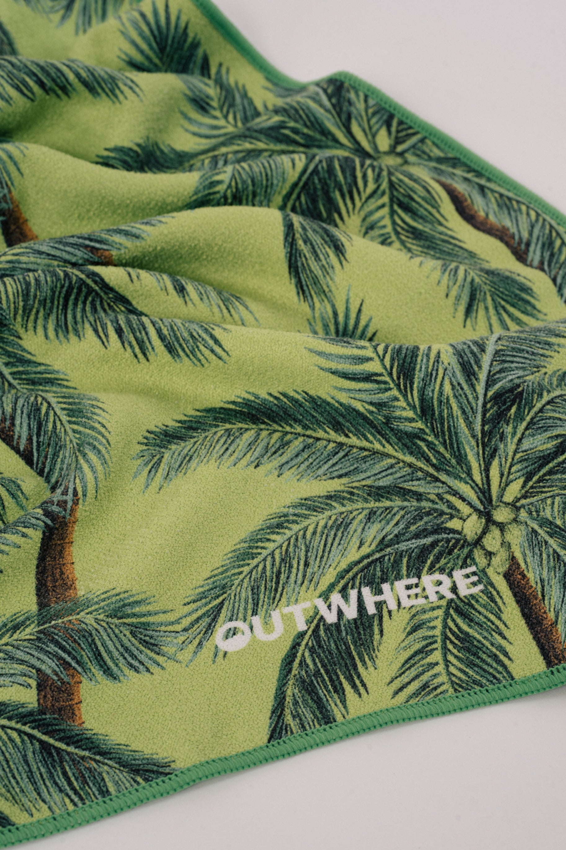 Close up shot of the Outwhere PH Everywhere towel in Buko (coconut) showing the material and design details and logo