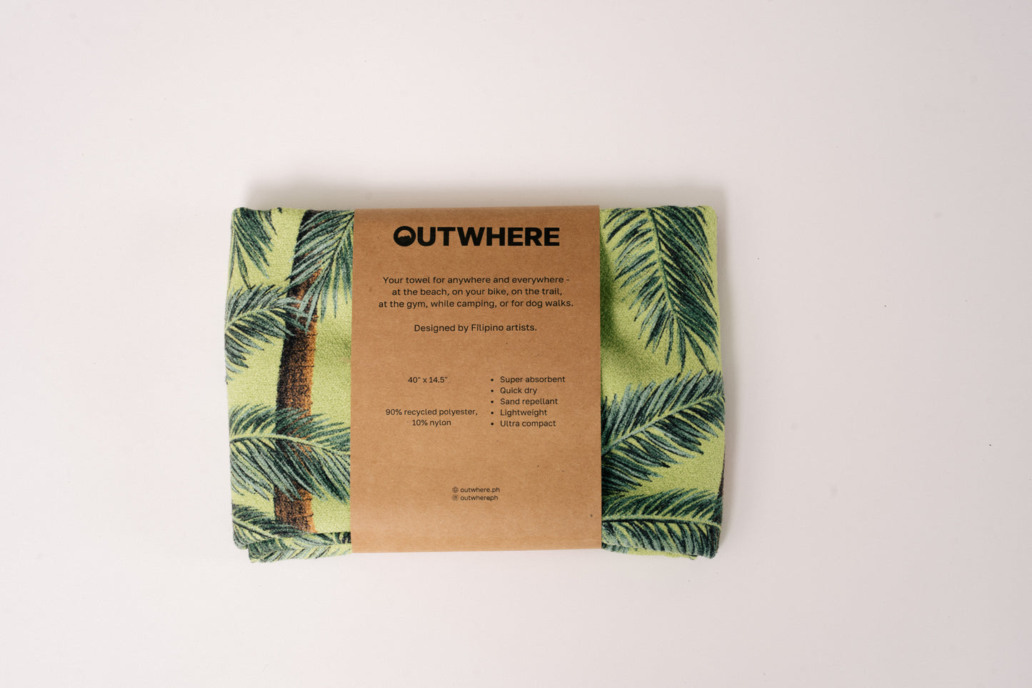 Folded Outwhere PH Everywhere Towel in Buko (coconut) in Packaging sleeve. Front of packaging sleeve shows product features, dimensions, and social media handles