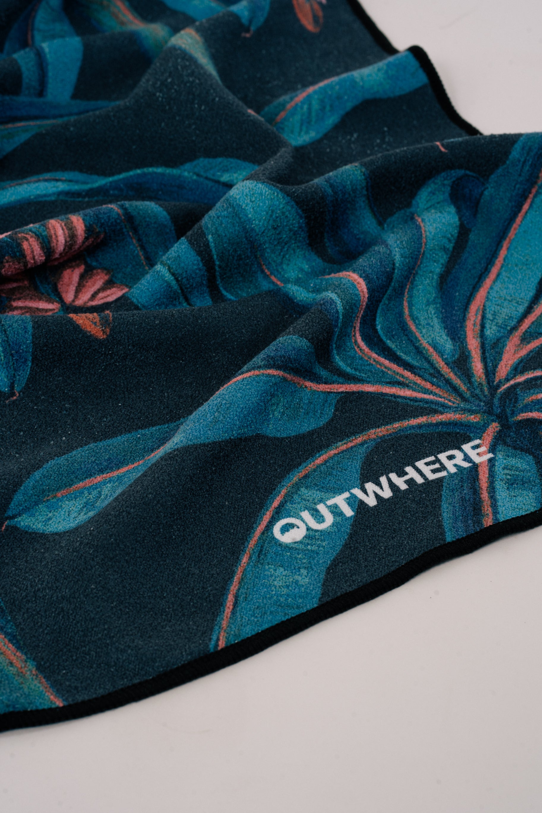 Close up shot of the Outwhere PH Everywhere towel in Saging Blue (Banana) showing the material and design details and logo