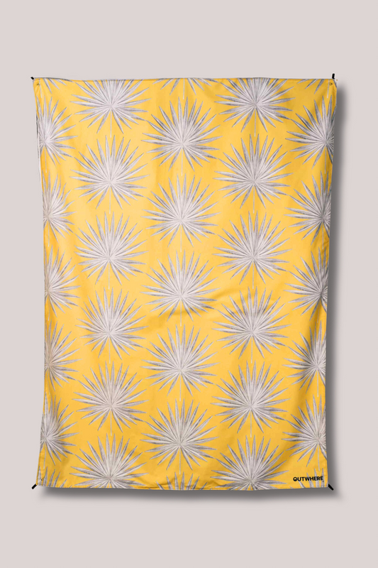 Flatlay on white background showing Outwhere PH Latag mat design in Anahaw print in yellow