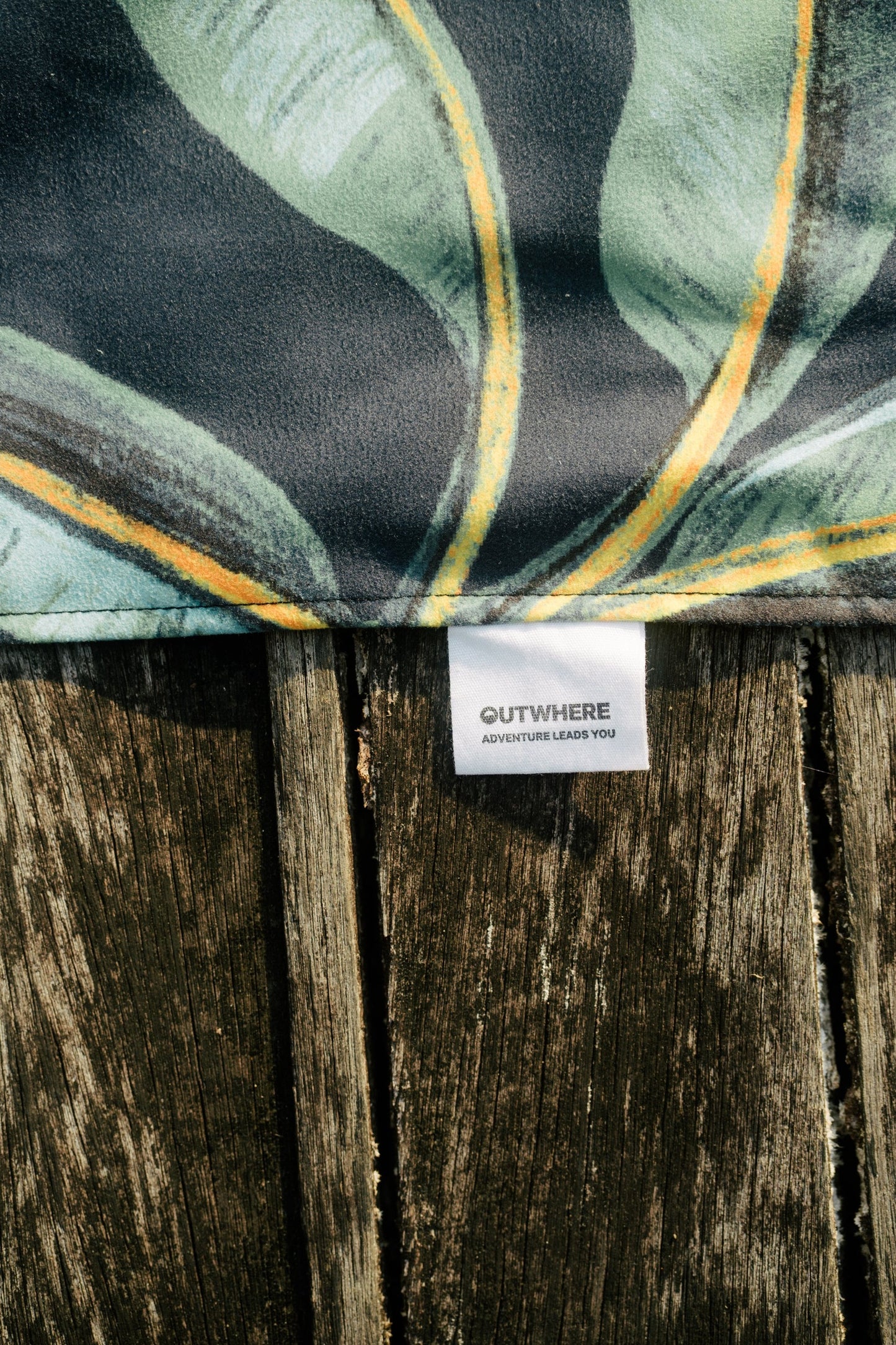 Close up shot of the Outwhere PH Latag care tag with tagline OUT WHERE ADVENTURE LEADS YOU